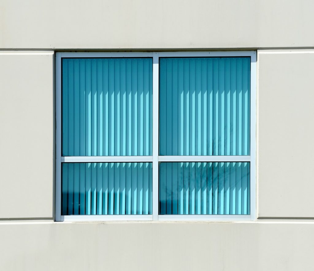 Turquoise blinds from outside the office