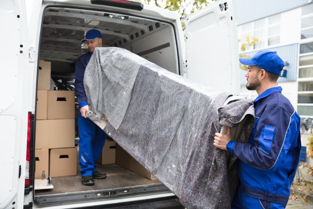 furniture being loaded up in van