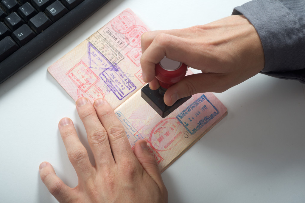 a man stamping a visa